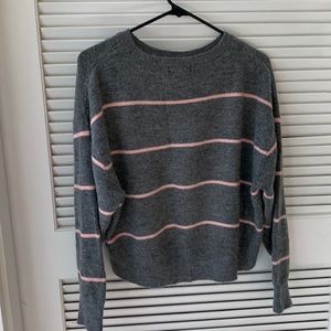 Warm striped pink and grey sweater.
